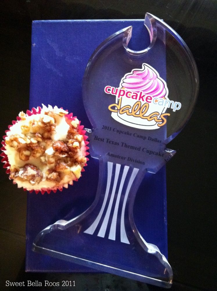 a cupcake trophy next to a pecan pie cupcake