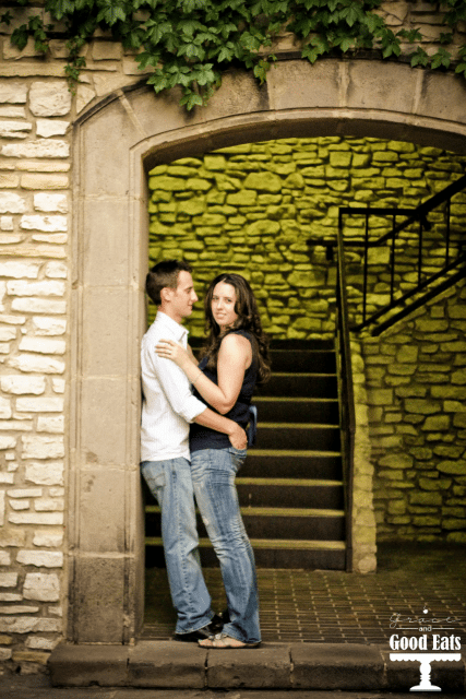 man and woman standing at the bottom of stairs 