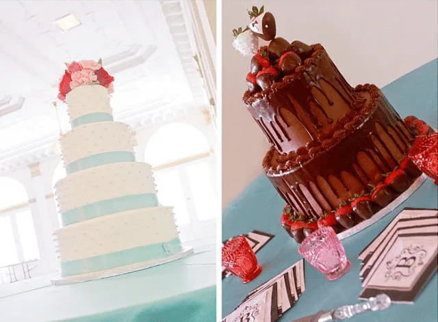 brides four tier wedding cake with blue ribbons and fresh flowers next to a chocolate grooms cake with chocolate covered strawberries