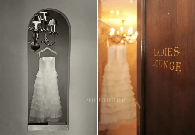 wedding dress hanging in doorway