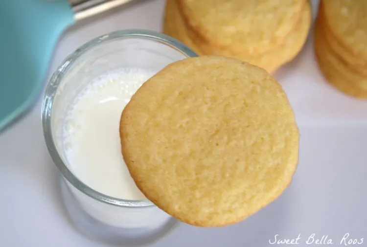 a vanilla instant pudding cookie resting on a glass of milk