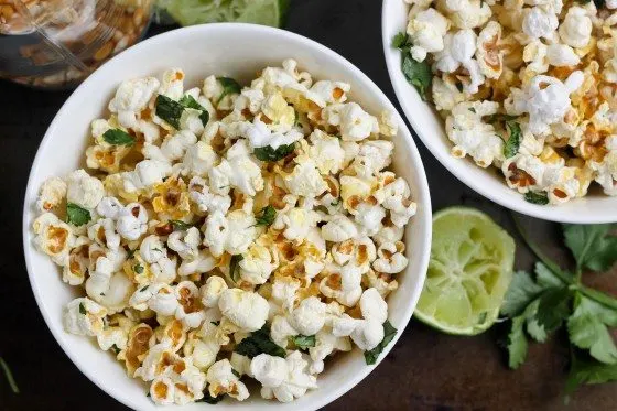 top view of savory cilantro popcorn in two white bowls 