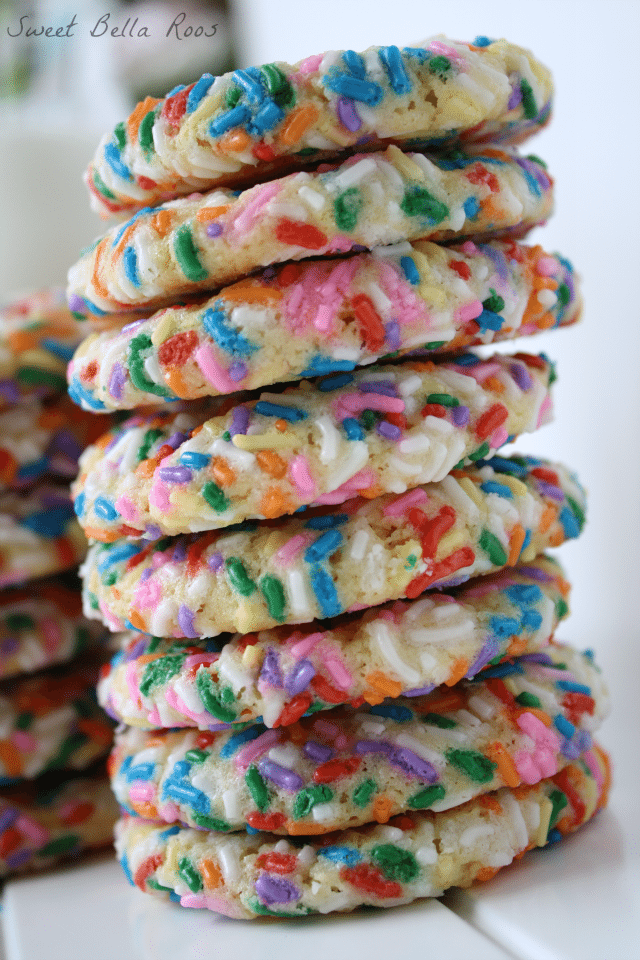 Tall stack of sprinkle cookies. 