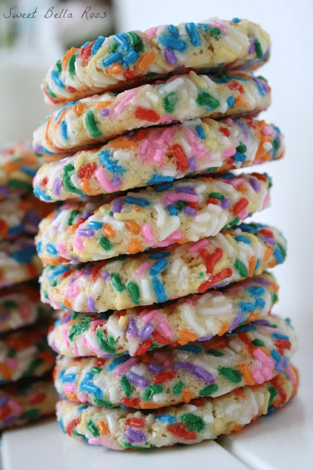 Tall stack of sprinkle cookies. 