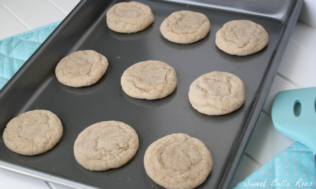 nine cinnamon cookies on a baking tray