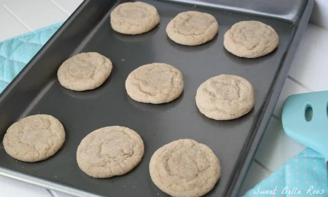 nine cinnamon cookies on a baking tray