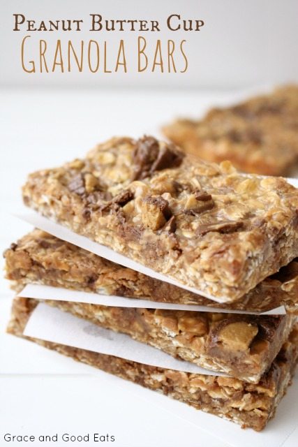 Peanut Butter Cup Granola Bars stacked between parchment paper