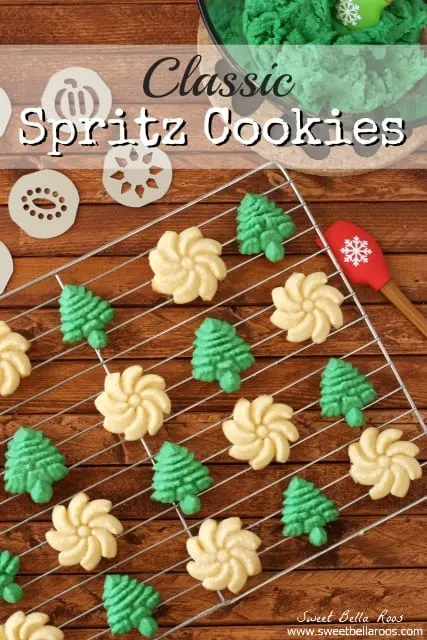 Create a new holiday tradition with this classic Spritz Cookies Recipe. Sharing my favorite cookie press as well as instructions for how to make Spritz Cookies without a press. The buttery cookies can be dressed up with sprinkles or different colors of dough. Spritz cookies lined up on a wire baking sheet