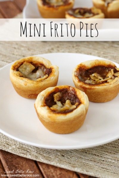Warm chili, corn chips, sharp cheddar cheese all inside a flaky crescent roll cup make for the most delicious mini Frito Chili Pies ever.