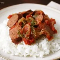 sausage, onions, and peppers over rice