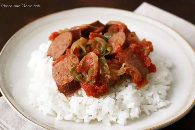 crockpot sausage and peppers with rice on a white plate 