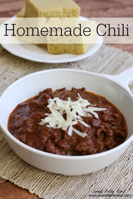 no bean chili topped with white cheese with a plate of cornbread