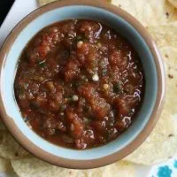 This Restaurant Style Salsa recipe is the best one I've ever made at home. Scoop it up with chips or use it to smother everything from eggs to enchiladas.