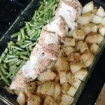 sheet pan full of green beans, chicken, and white potatoes