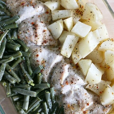 casserole dish with green beans, chicken, and potatoes