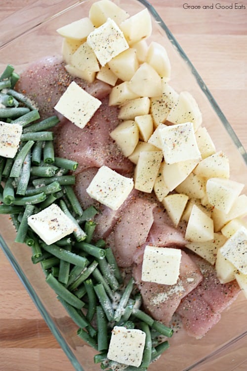 casserole dish with italian dressing chicken topped with butter