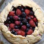 simple berry galette tart on a baking sheet