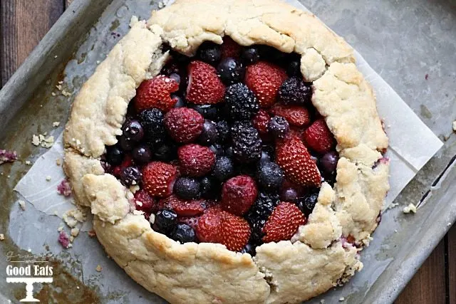simple berry galette tart on a baking sheet