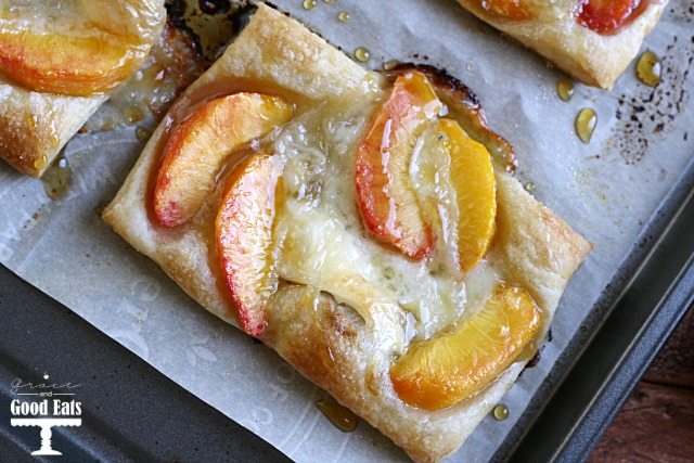 close-up puff pastry tart with peaches