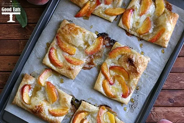 sheet pan full of peach pastry tarts