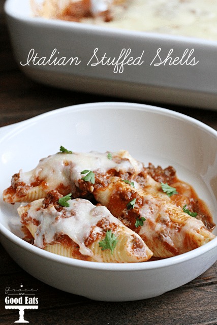 three italian stuffed shells in a white bowl