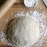 Enjoy pizza night at home with this easy homemade pizza dough recipe. Load it up with cheese and your choice of toppings for a delicious weeknight meal.