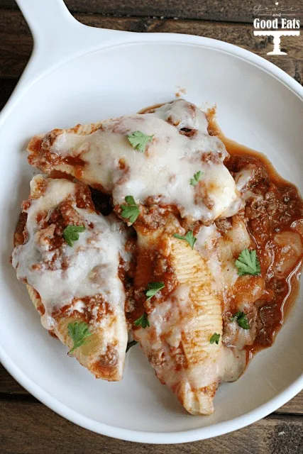 overhead view of italian meat stuffed shells in a white bowl