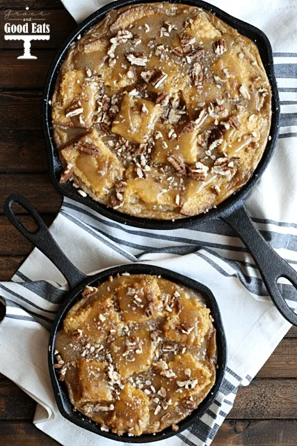 overhead view of two cast iron skillets full of cornbread bread pudding