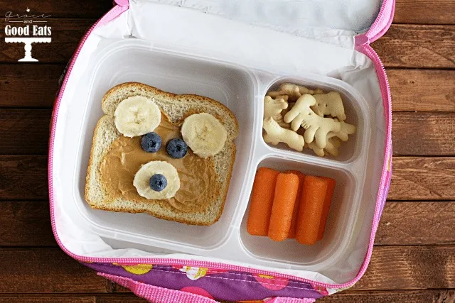 teddy bear toast in a lunchbox with carrots and crackers