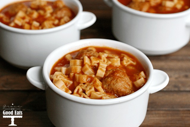 three white ramekins filled with homemade spaghettios with meatballs