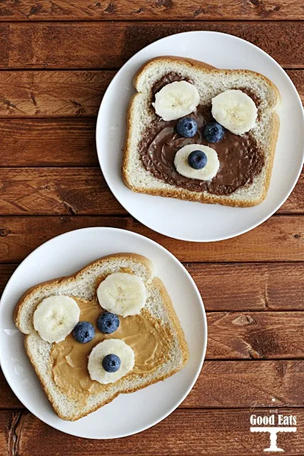 teddy bear toast made with peanut butter and hazelnut spread, bananas, and blueberries