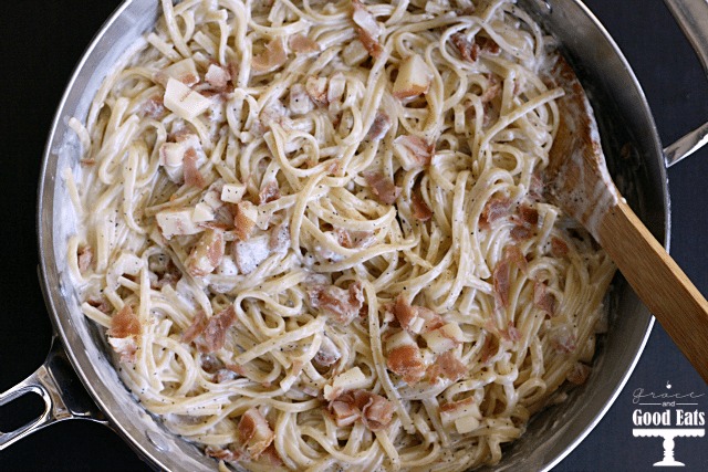 Overhead view of Parmesan prosciutto pasta in a skillet. 