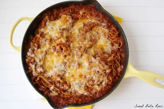 top view of baked skillet spaghetti in a yellow skillet 