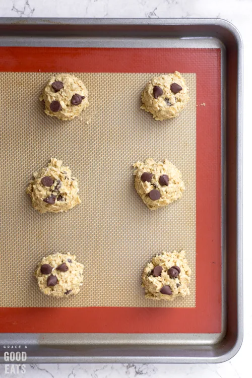 raw protein cookie dough on a baking sheet