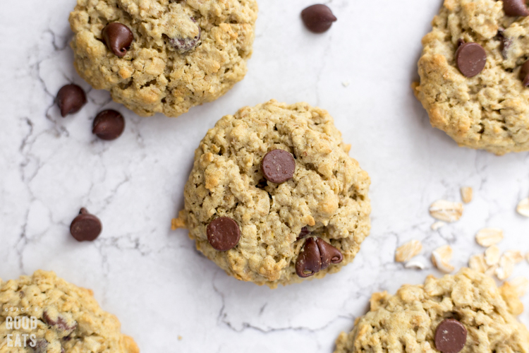 oatmeal protein cookies with chocolate chips and oats sprinkled around