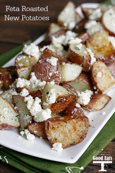 oven roasted new potatoes on a white platter with feta