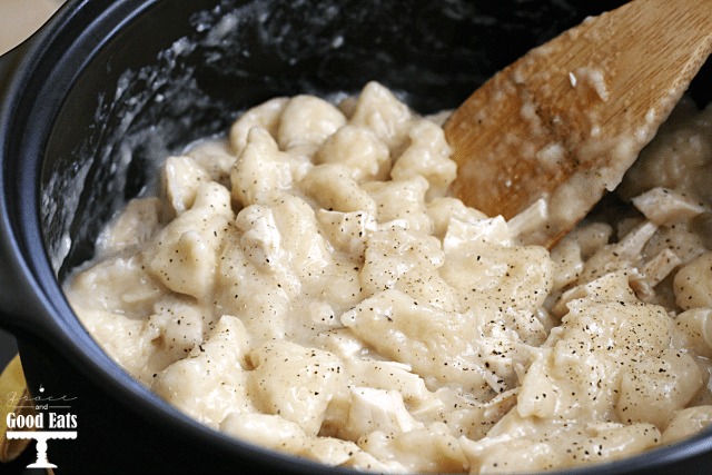 chicken and dumplings with biscuits in a pot. 