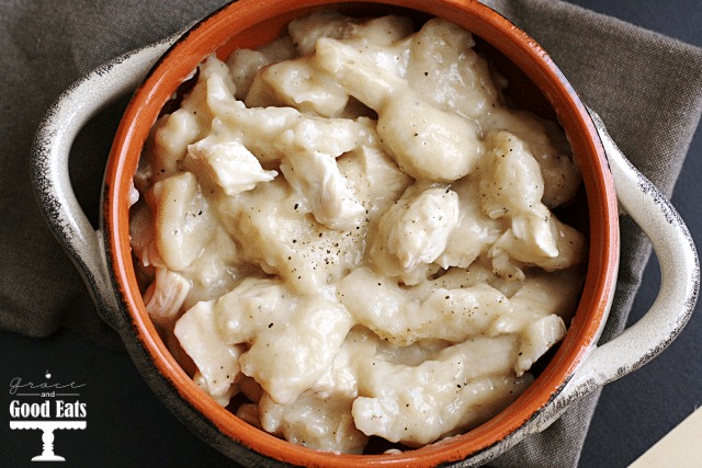 Overhead view of chicken and dumplings using biscuits in a small dish. 