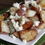 Feta Roasted New Potatoes- baby red potatoes tossed with feta and fresh thyme. Such an easy, but impressive side dish!