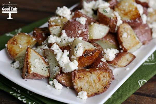 feta roasted new potatoes on a white platter