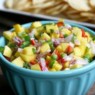 This Mango Salsa is refreshingly light and goes great with chips or crackers. Full of bright colors and bursts of flavor, it's perfect for a summer barbecue.