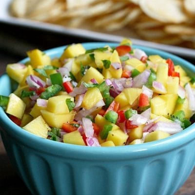 This Mango Salsa is refreshingly light and goes great with chips or crackers. Full of bright colors and bursts of flavor, it's perfect for a summer barbecue.