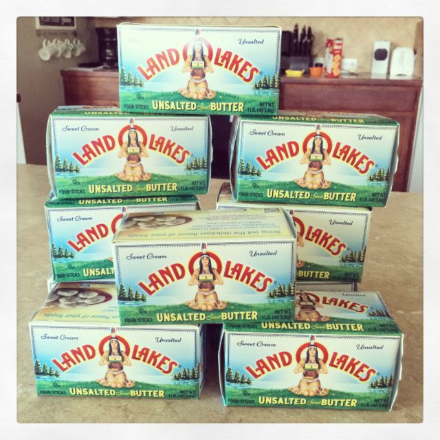 eight packages of butter stacked on counter