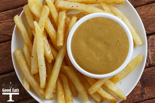 plate of french fries with dish of fry sauce