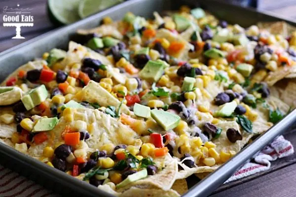 These Spicy Black Bean Four Cheese Nachos are perfect for a crowd or a weeknight dinner!