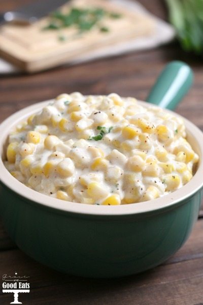 small saucepan with homemade creamed corn and topped with green onions