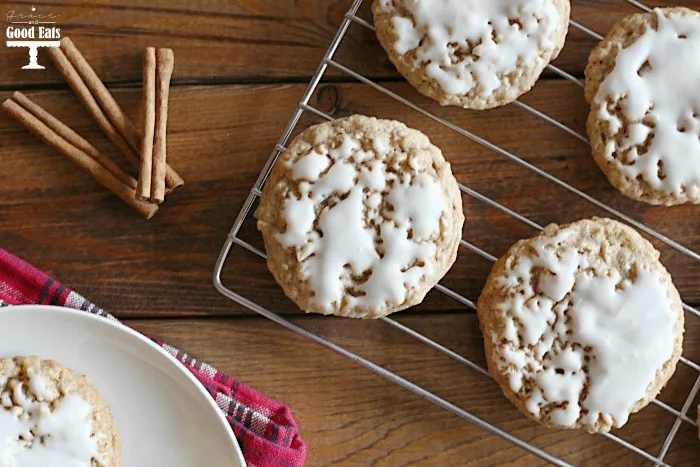 overhead view of frosted old fashioned oatmeal cookies on a wire rack. 