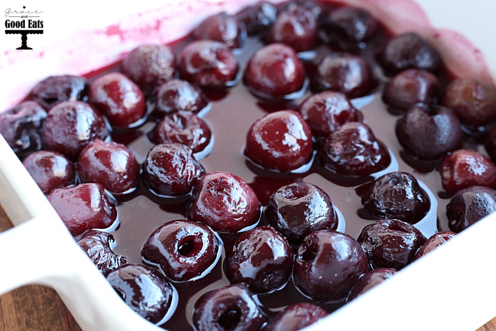 roasted bourbon cherries in a white dish