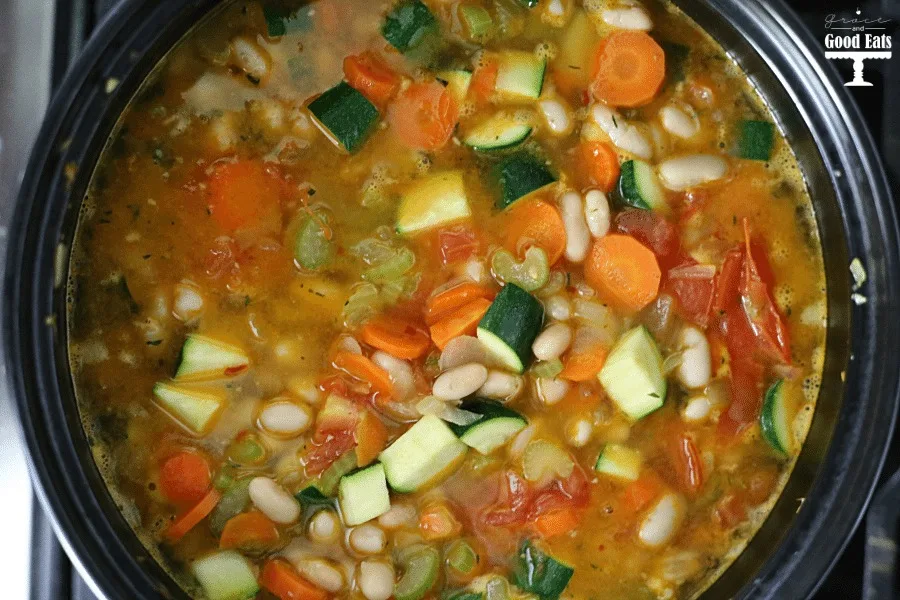 Overhead view showing how to make tuscan soup. 