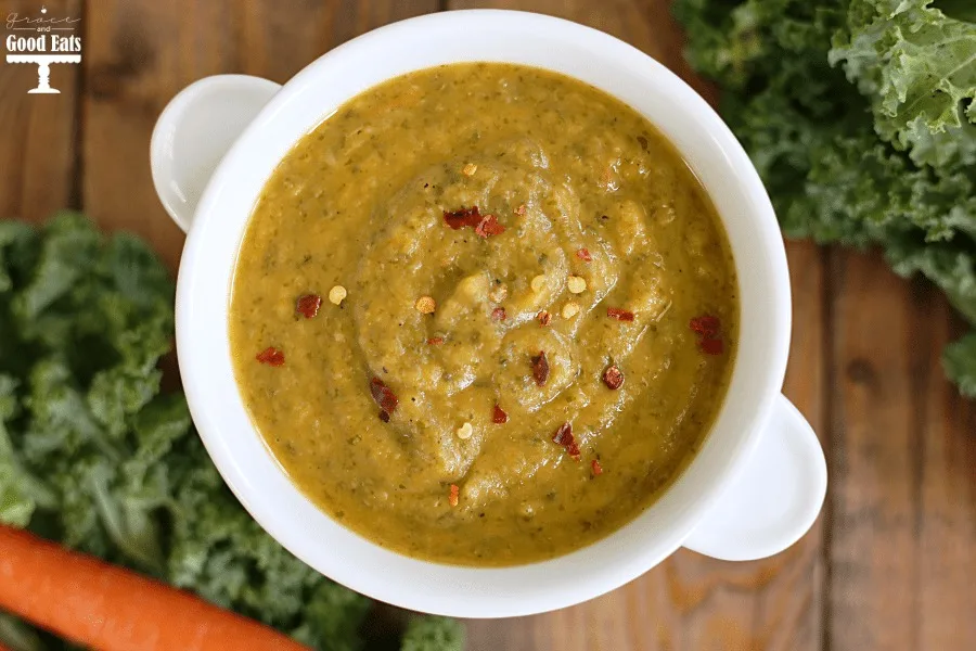 Overhead view of tuscan bean soup in a white ramekin. 